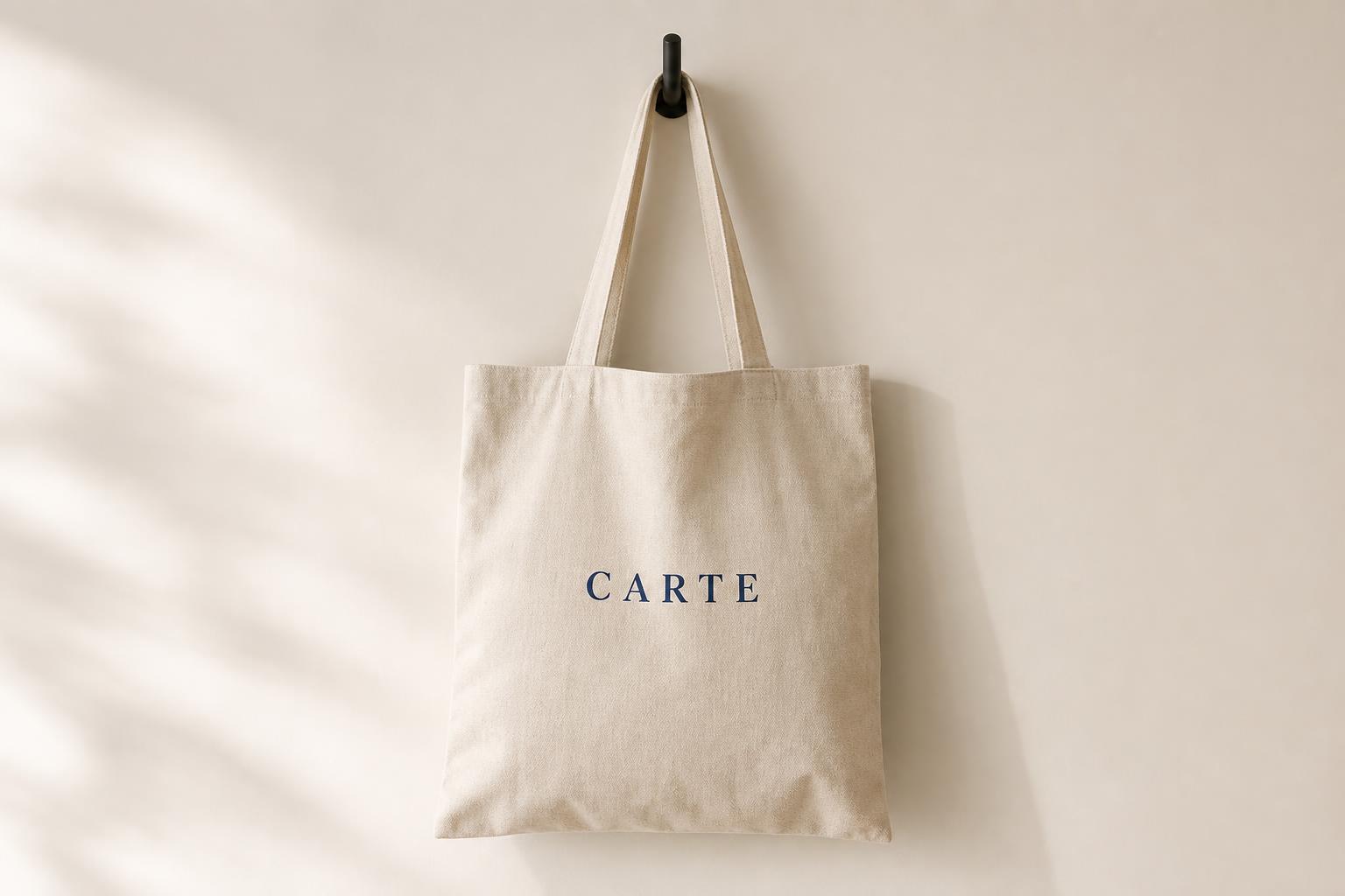 Carte canvas tote in natural cream with subtle navy logo